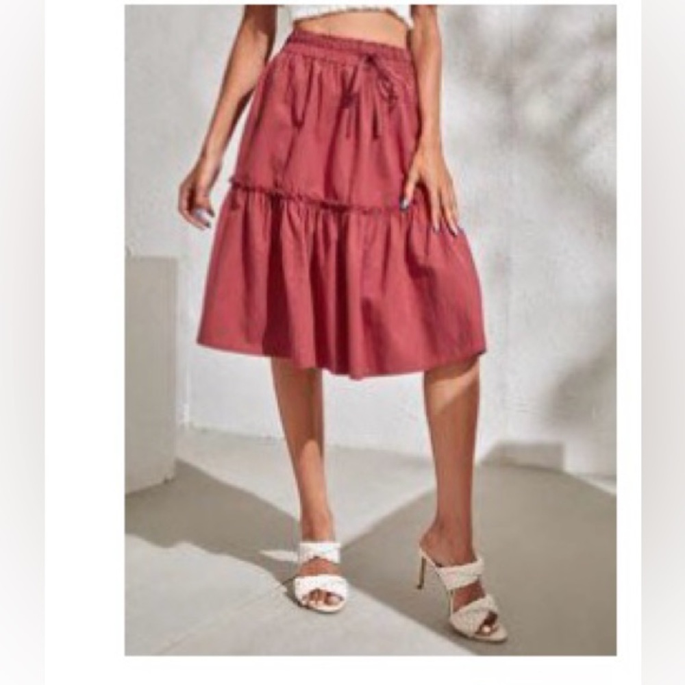Knee length pink skirt with pull string perfect condition